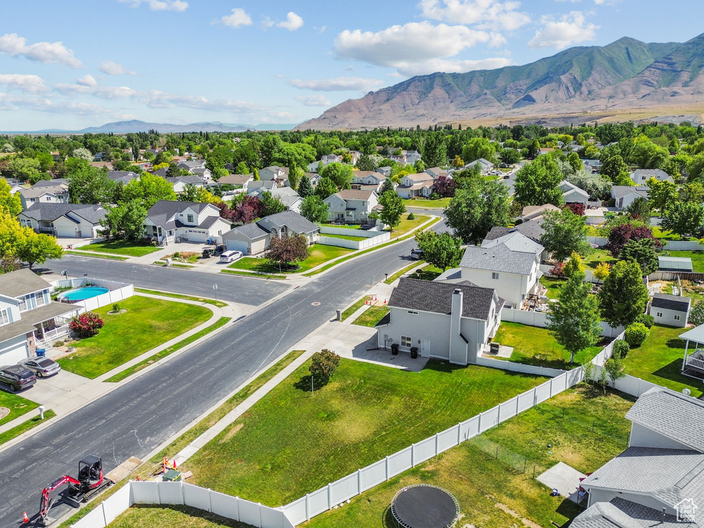 Aerial perspective of suburban area with a mountainous background