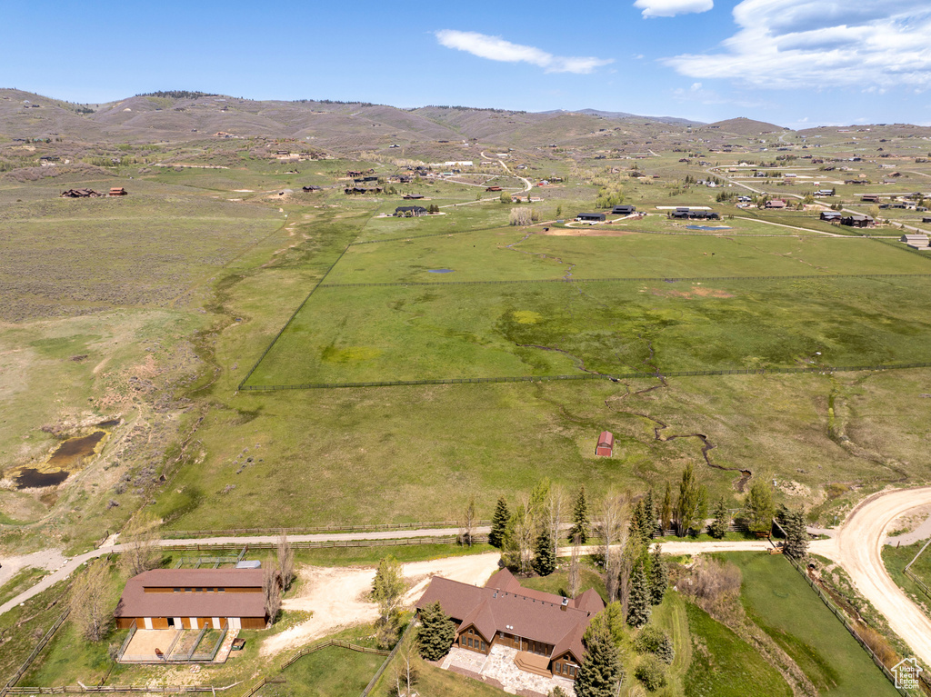 Aerial view of property and surrounding area with rural landscape and mountains