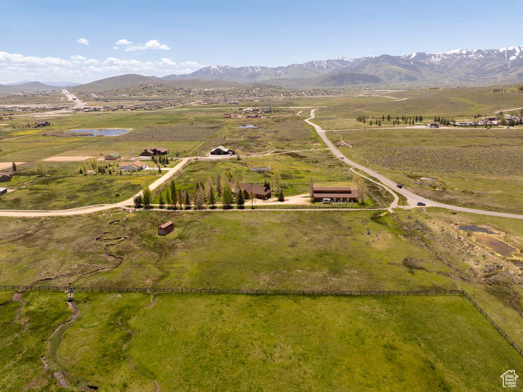 Overview of rural landscape featuring a mountain backdrop