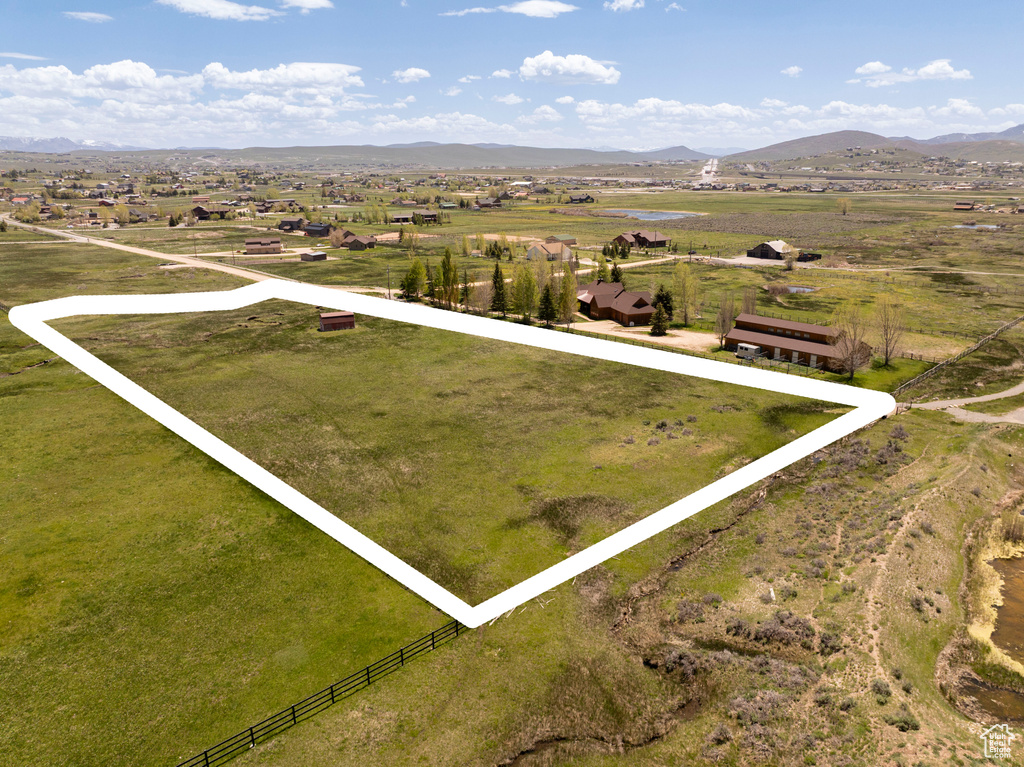 Overview of rural landscape with mountains and property boundaries highlighted