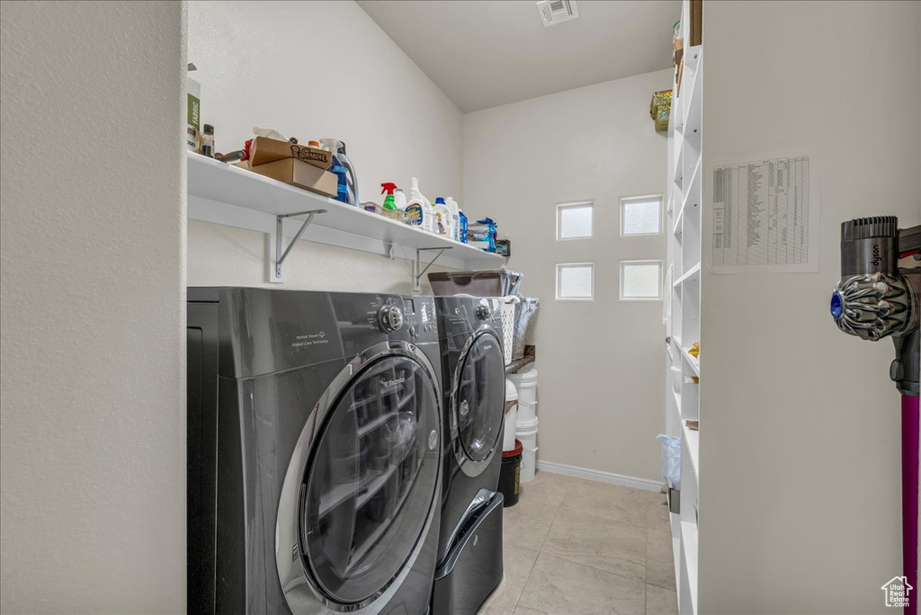 Laundry area featuring independent washer and dryer