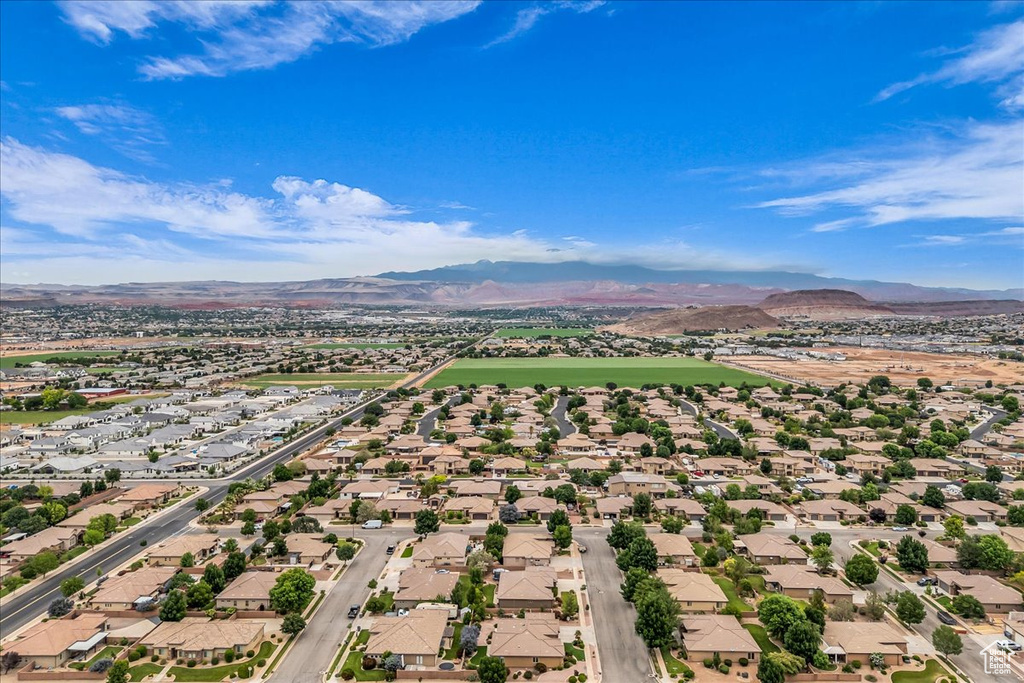 Aerial perspective of suburban area with a mountain backdrop
