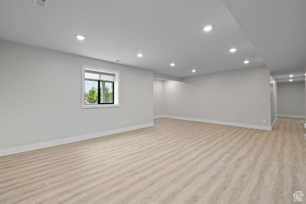 Spare room with recessed lighting, baseboards, and light wood-style flooring