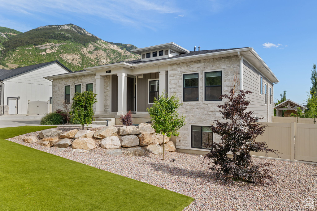 View of front of property featuring a mountain view and stone siding
