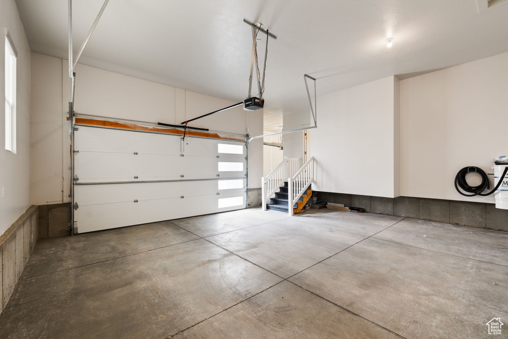 Garage featuring a garage door opener