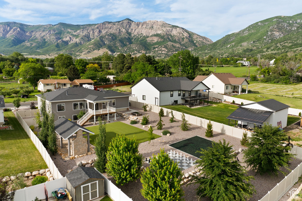 View of mountain backdrop featuring nearby suburban area