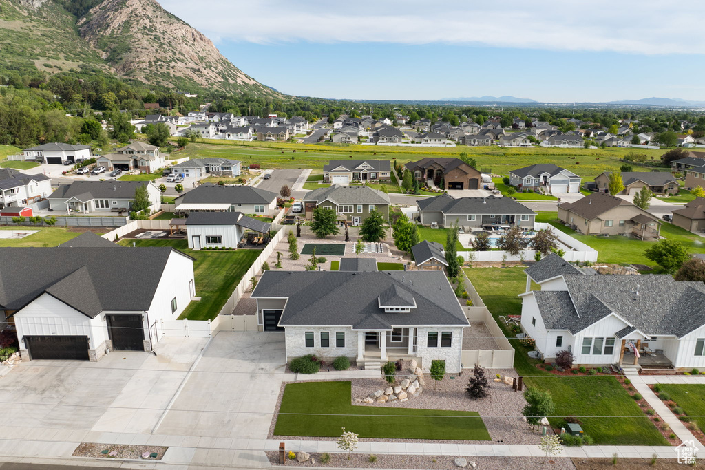 Aerial perspective of suburban area with a mountainous background