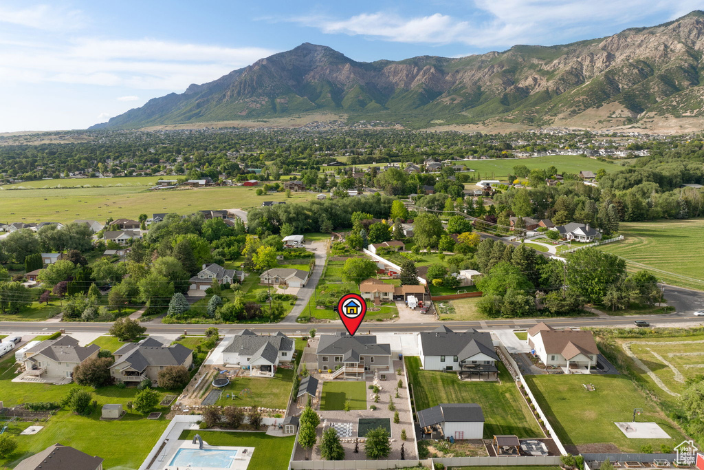 Aerial perspective of suburban area featuring a mountainous background