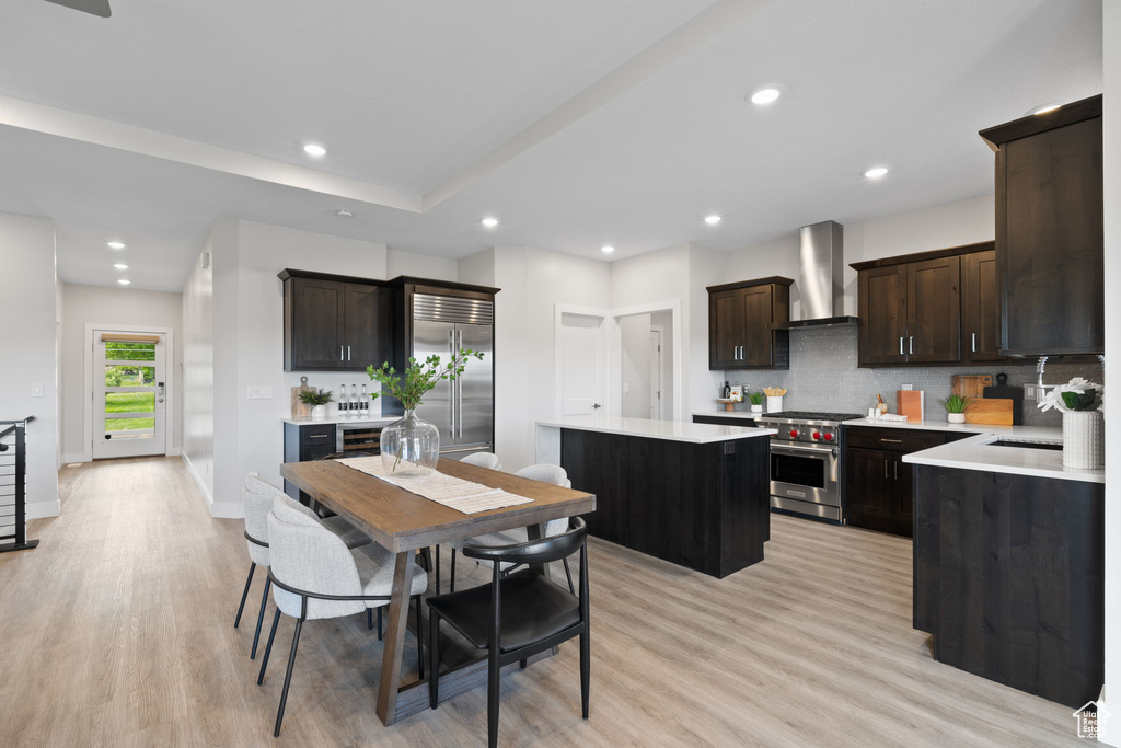 Dining area featuring light wood-style flooring, recessed lighting, and baseboards