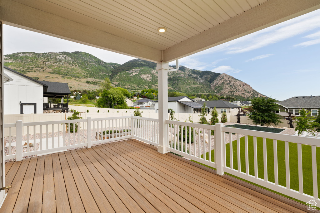 Deck featuring a mountain view and a residential view