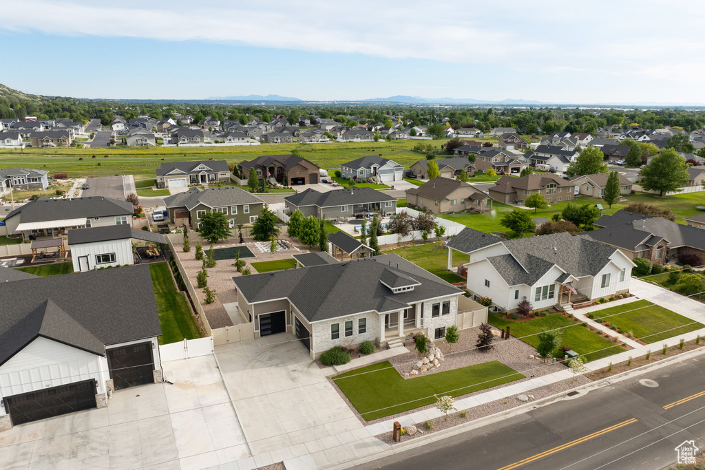 Aerial perspective of suburban area with a mountain backdrop