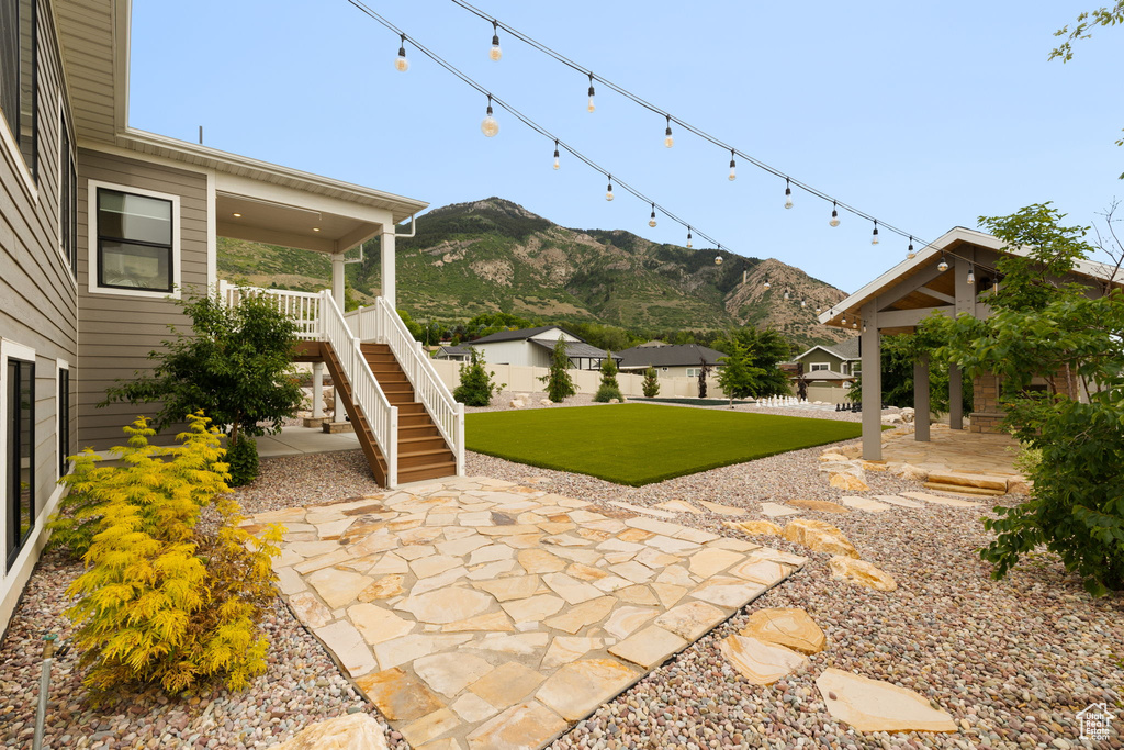View of patio / terrace featuring a mountain view and stairway