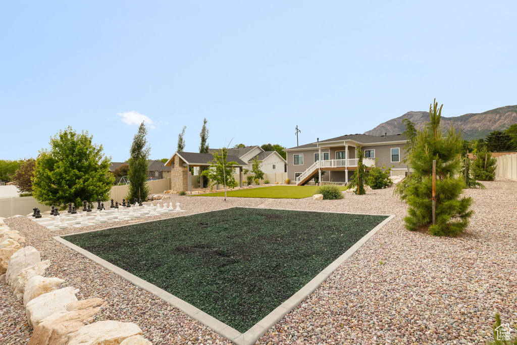 View of yard featuring a residential view, a patio area, and stairs