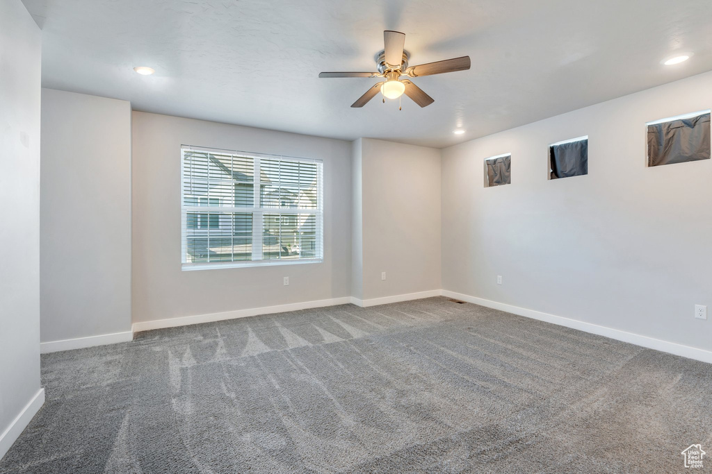 Unfurnished room with a ceiling fan, recessed lighting, carpet, and baseboards