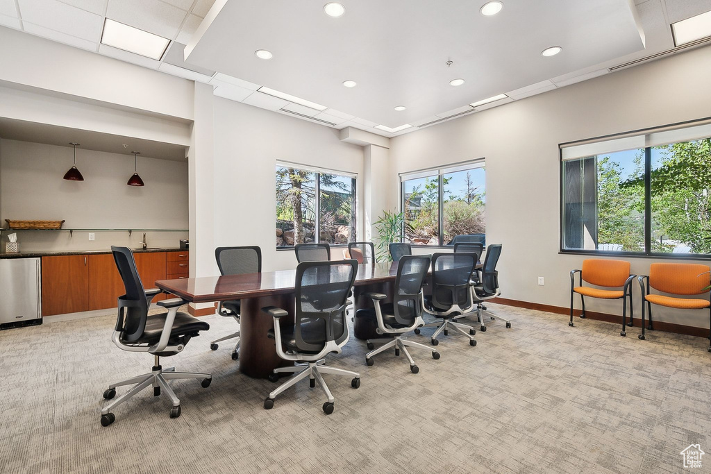 Office space featuring light carpet, recessed lighting, and baseboards