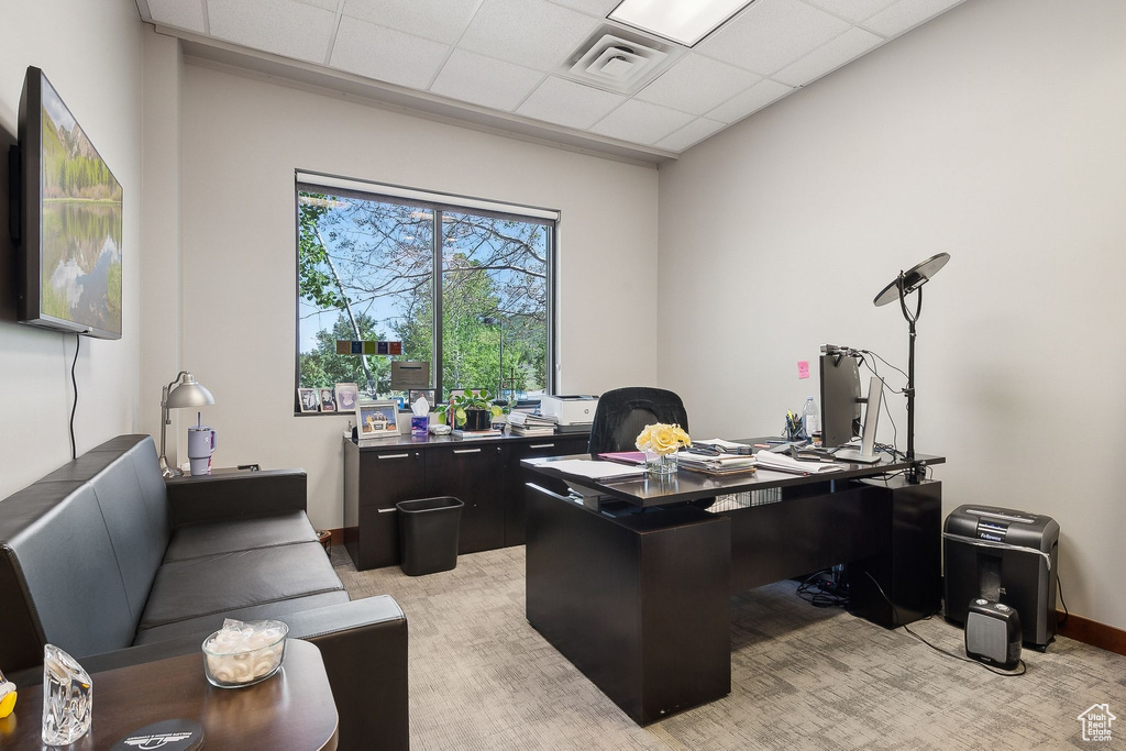 Office area featuring a paneled ceiling