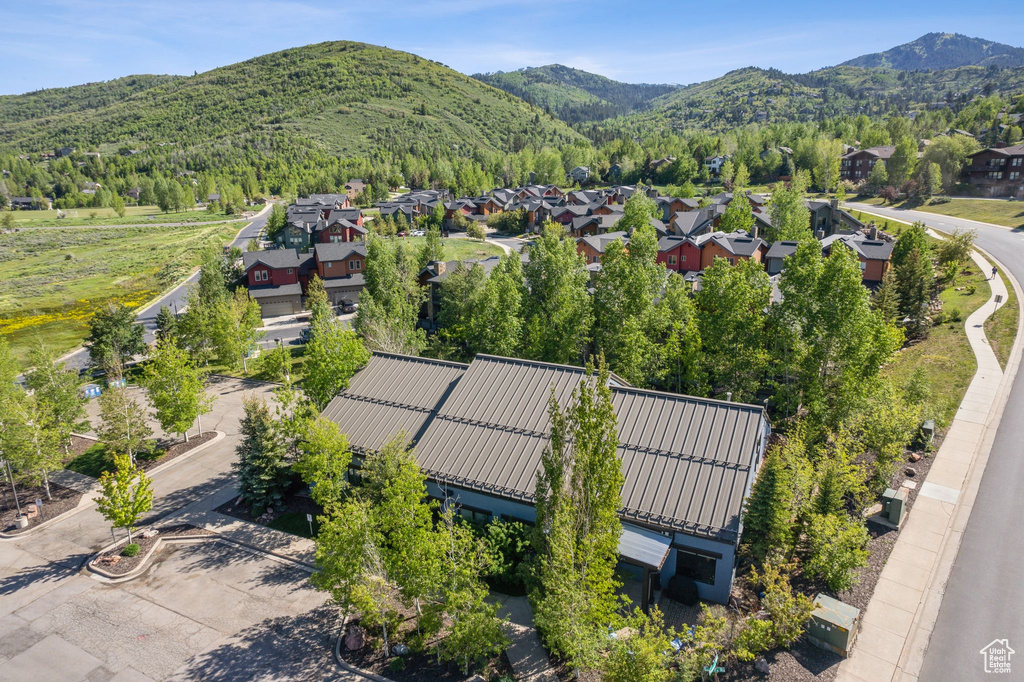 Aerial view of residential area featuring mountains