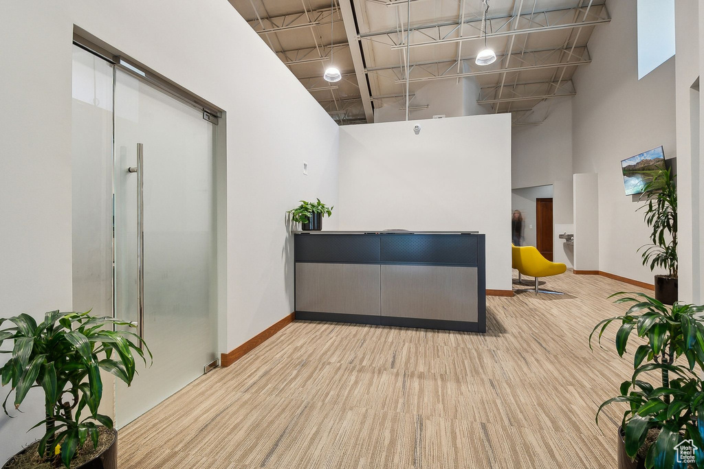Interior space with a high ceiling and baseboards