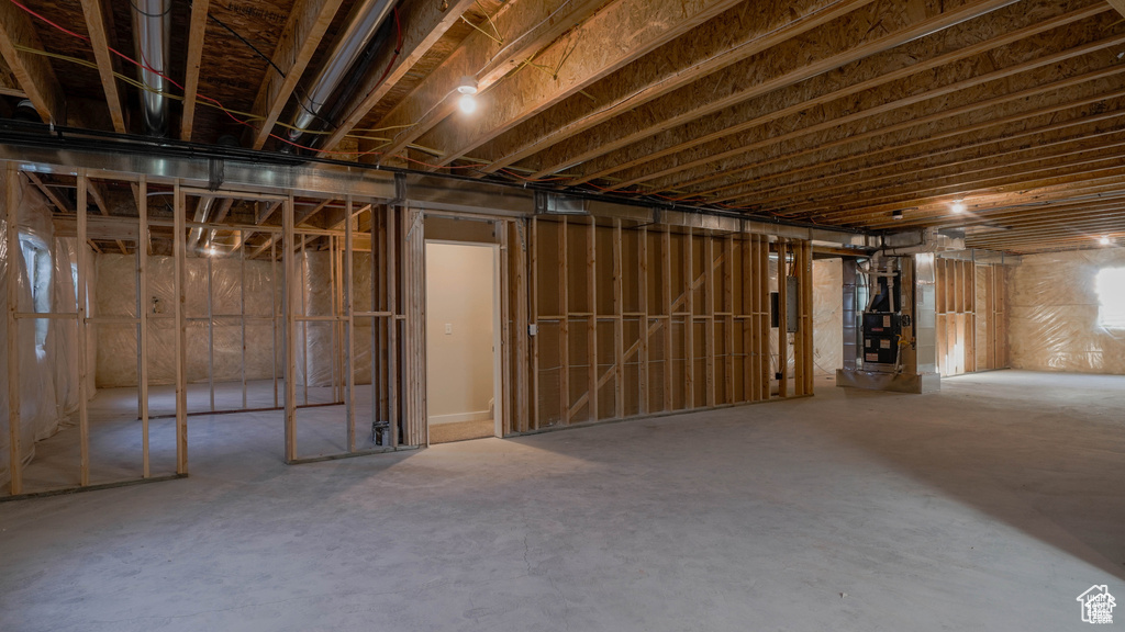 Unfinished below grade area with heating unit