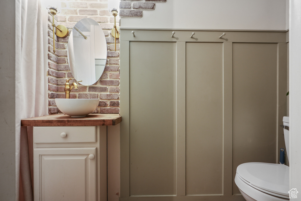 Bathroom featuring vanity and toilet