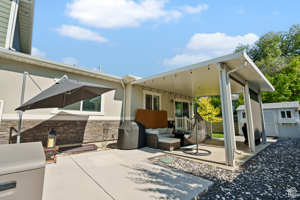 View of patio / terrace with an outdoor living space and an outdoor structure