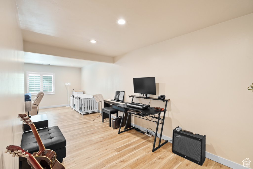 Office area featuring wood finished floors, recessed lighting, and baseboards