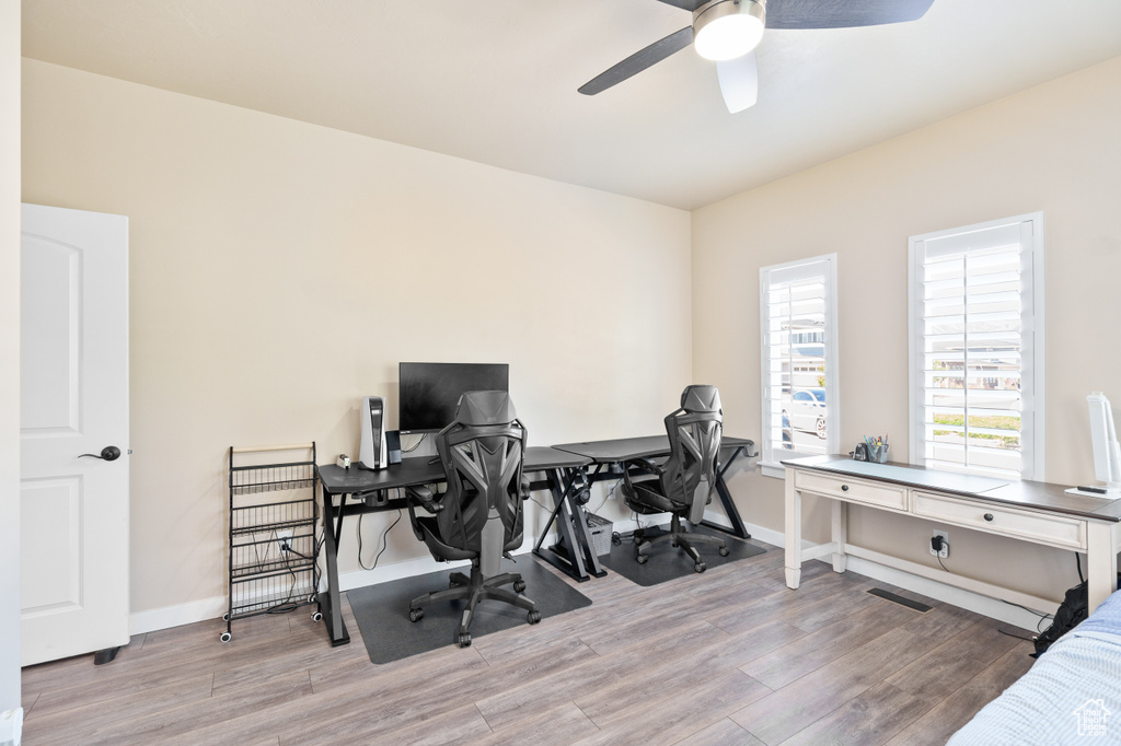 Office featuring ceiling fan, wood finished floors, and baseboards