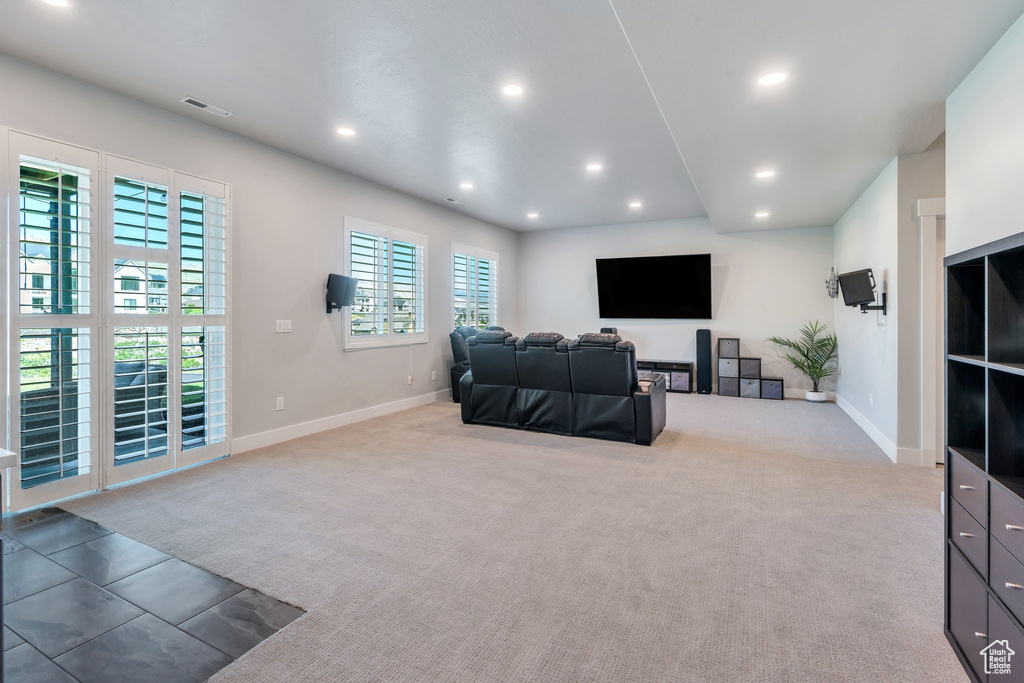 Living room with recessed lighting, baseboards, and carpet floors