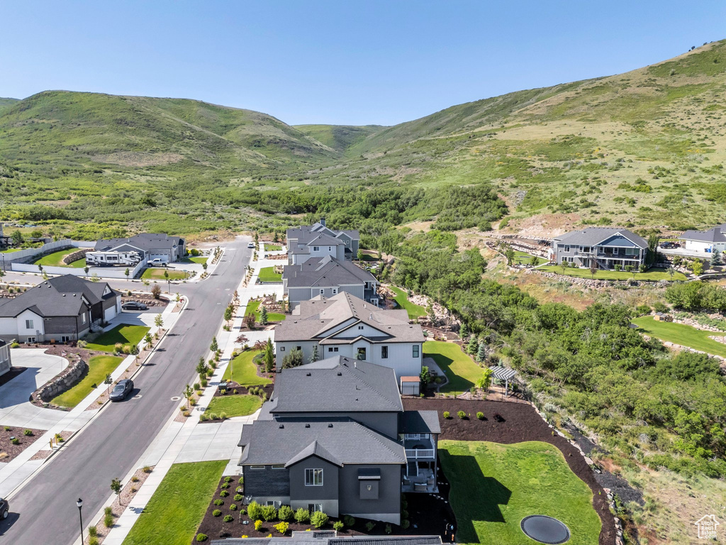 Aerial view of residential area featuring mountains