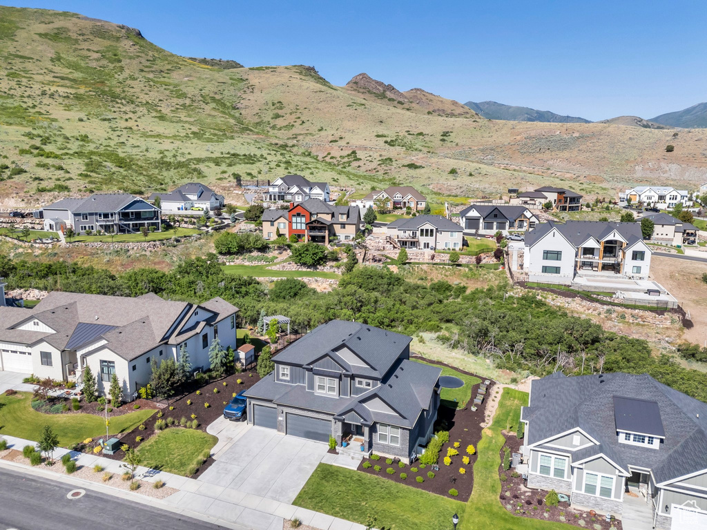 Aerial perspective of suburban area with a mountain backdrop