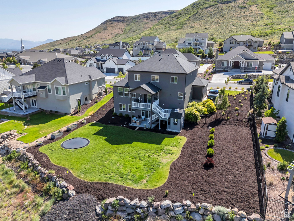 Aerial perspective of suburban area featuring a mountainous background