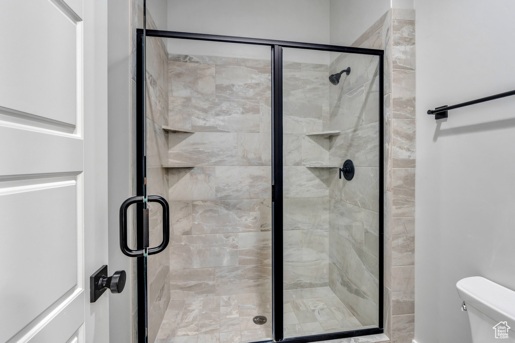 Bathroom with toilet and a shower stall