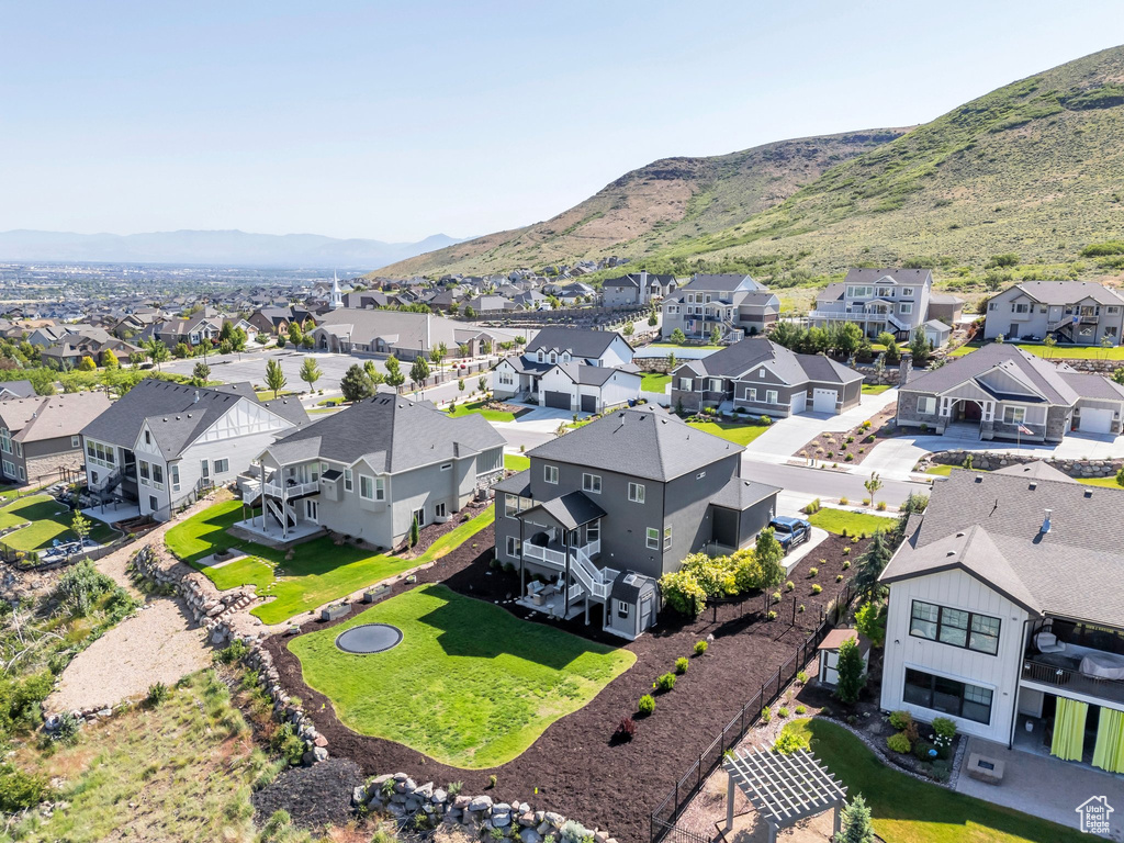 Aerial view of residential area featuring a mountain backdrop