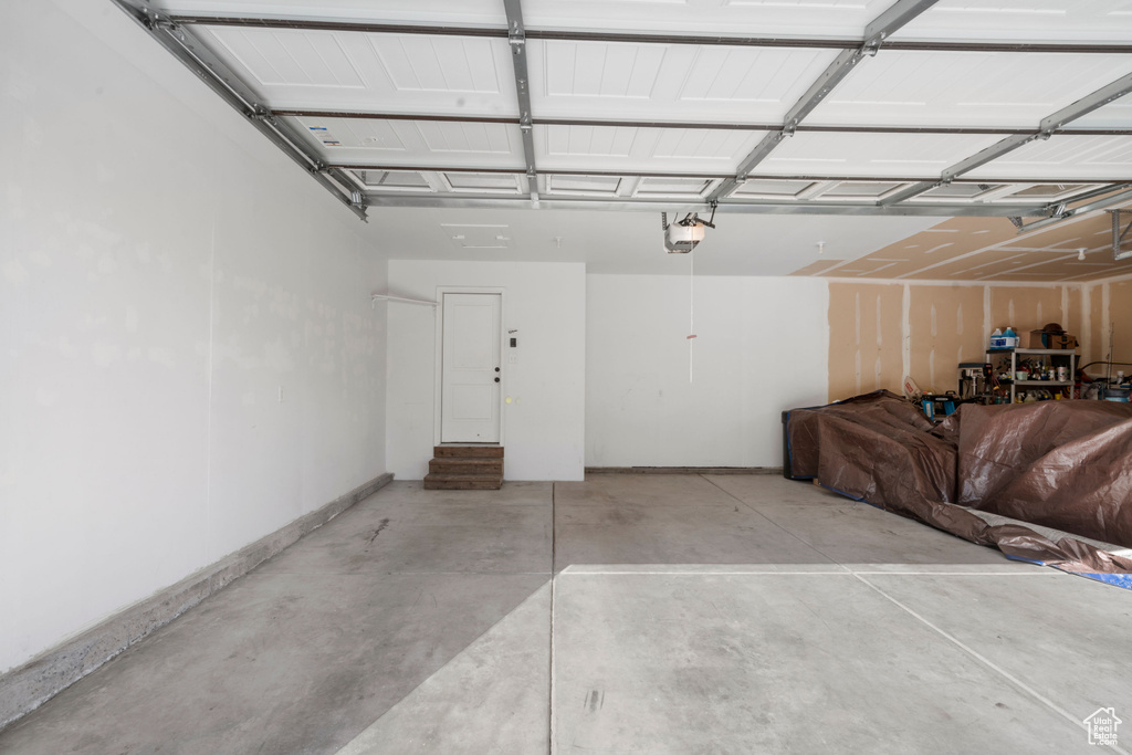 Garage featuring a garage door opener