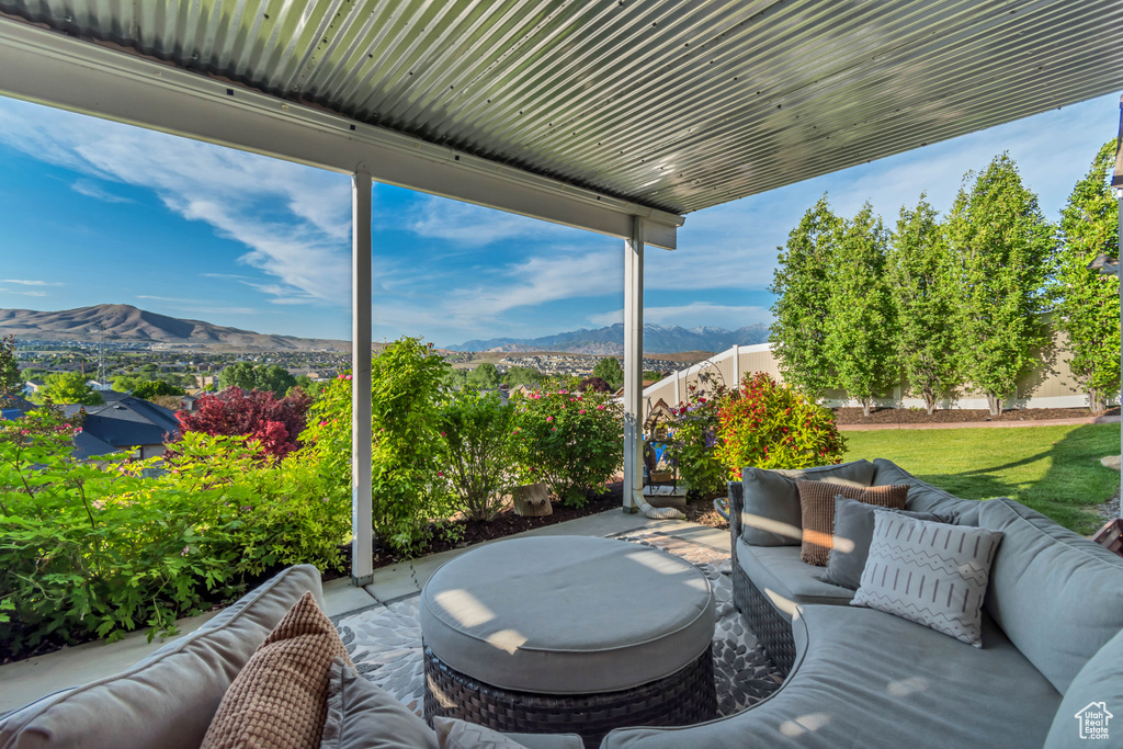 View of patio / terrace featuring an outdoor living space and a mountain view