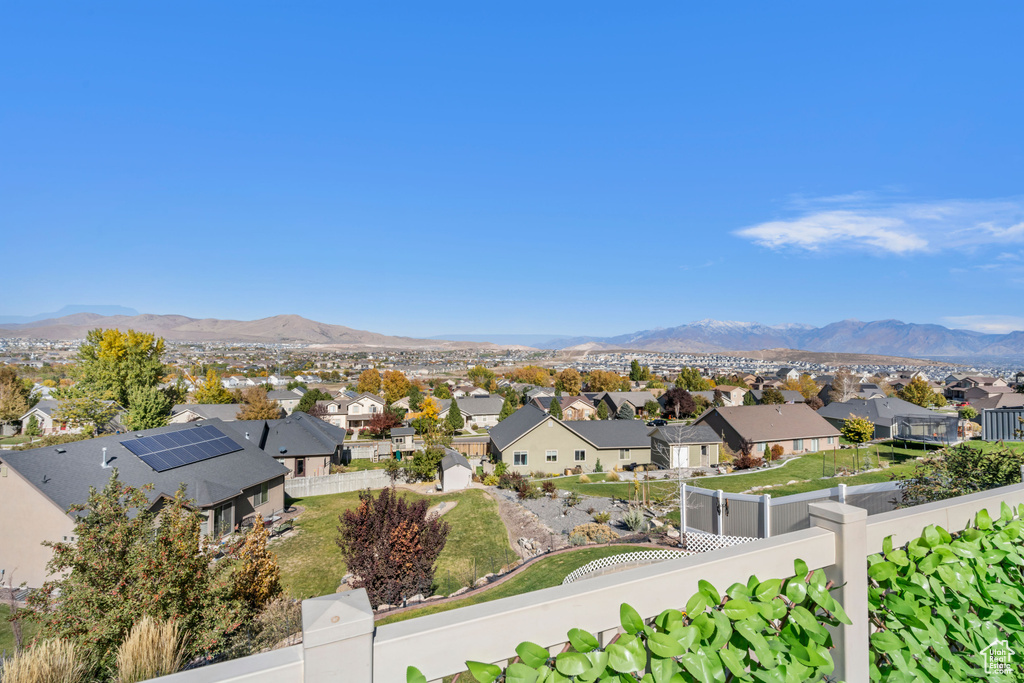 View of mountain backdrop featuring nearby suburban area