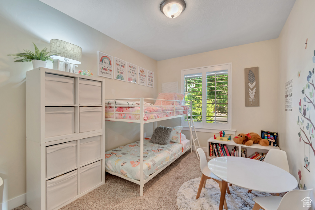 Bedroom with carpet flooring and baseboards
