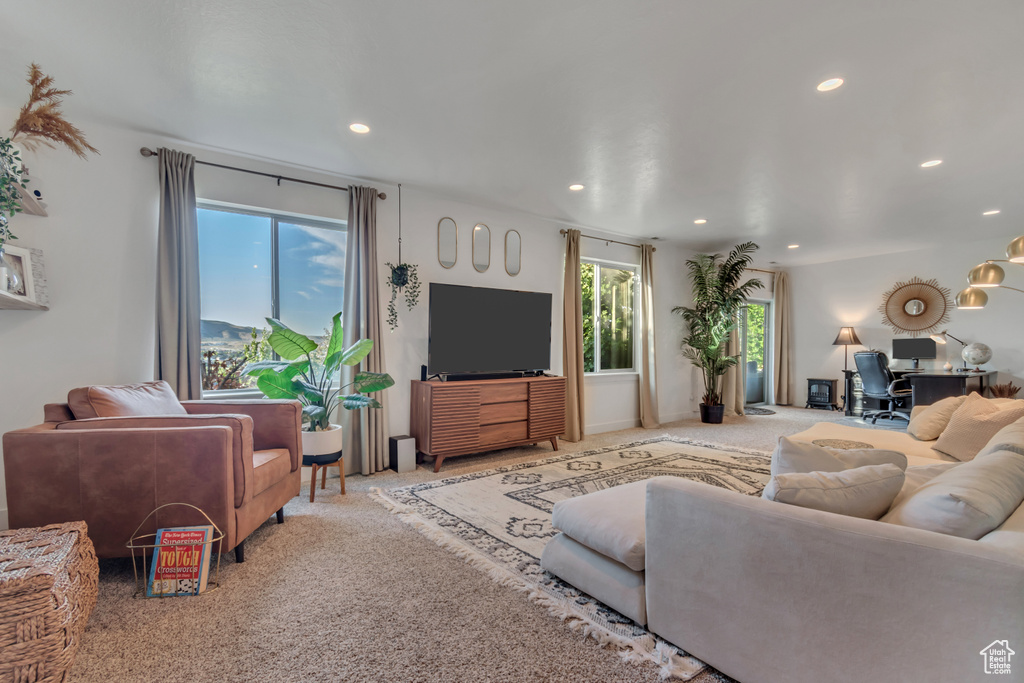 Living room with a desk, recessed lighting, and carpet floors