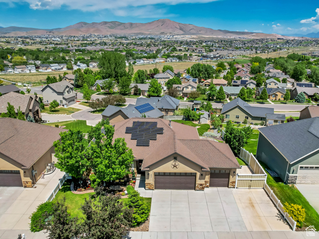 Aerial view of residential area featuring a mountainous background