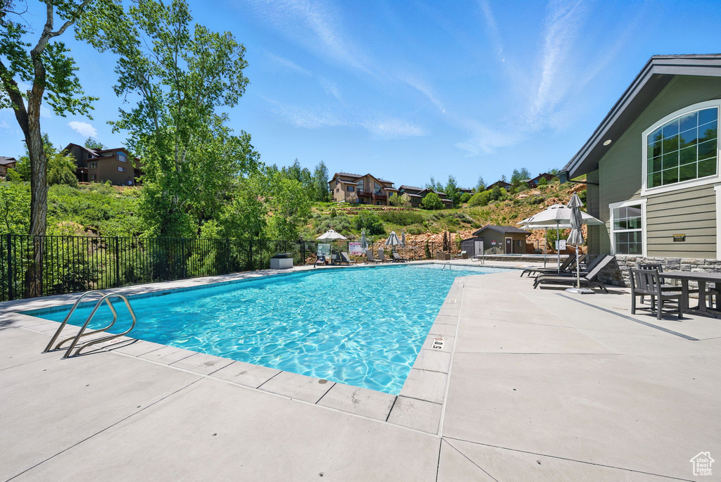 View of swimming pool featuring a patio