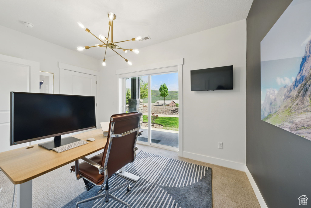 Office space with carpet flooring, a chandelier, and baseboards