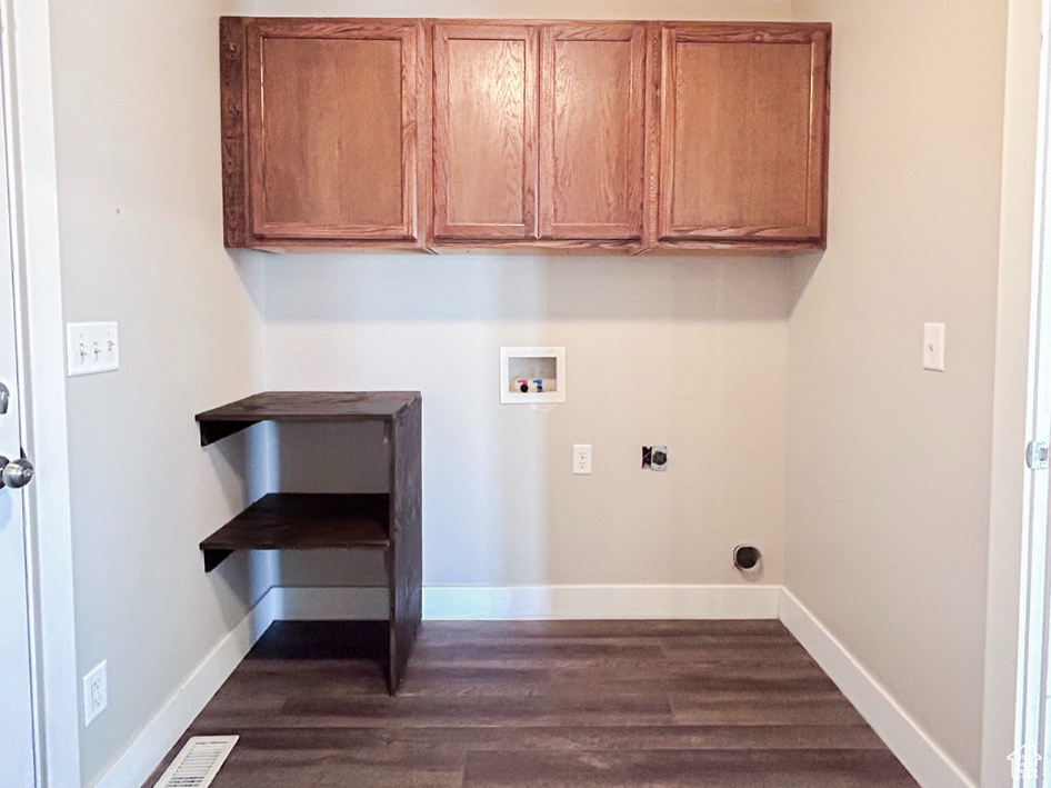 Laundry room featuring washer hookup, hookup for an electric dryer, dark wood-style flooring, baseboards, and a textured ceiling