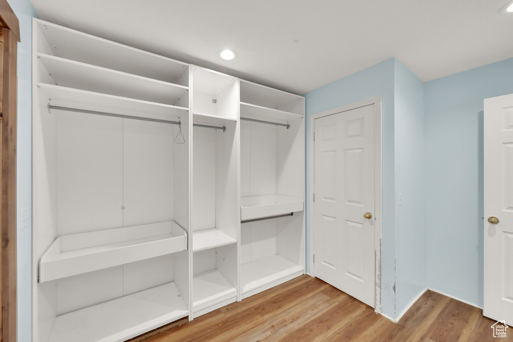 Mudroom with wood finished floors and recessed lighting