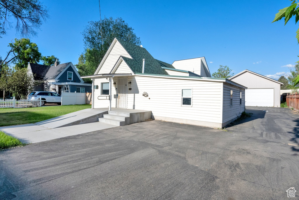View of front of house featuring a detached garage