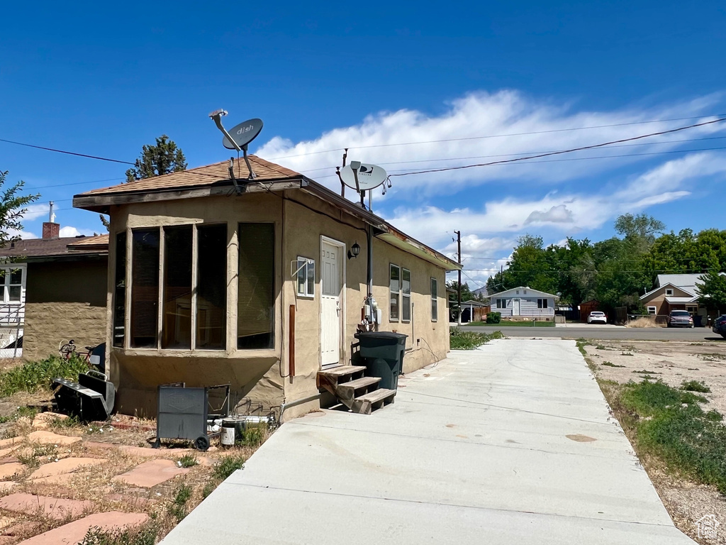 View of front of property featuring stucco siding and entry steps