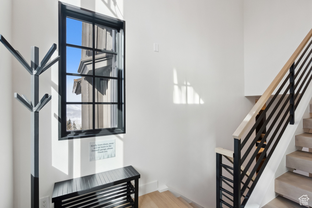 Staircase featuring wood finished floors