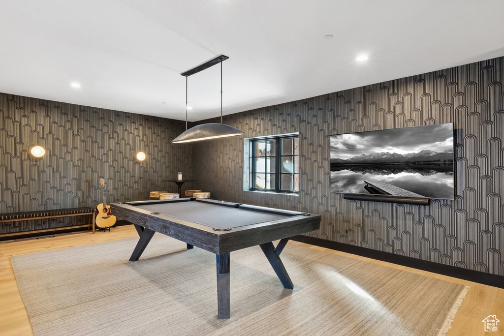 Game room featuring wood finished floors and billiards