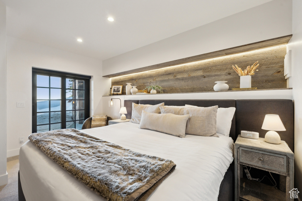 Bedroom with recessed lighting, baseboards, and access to exterior