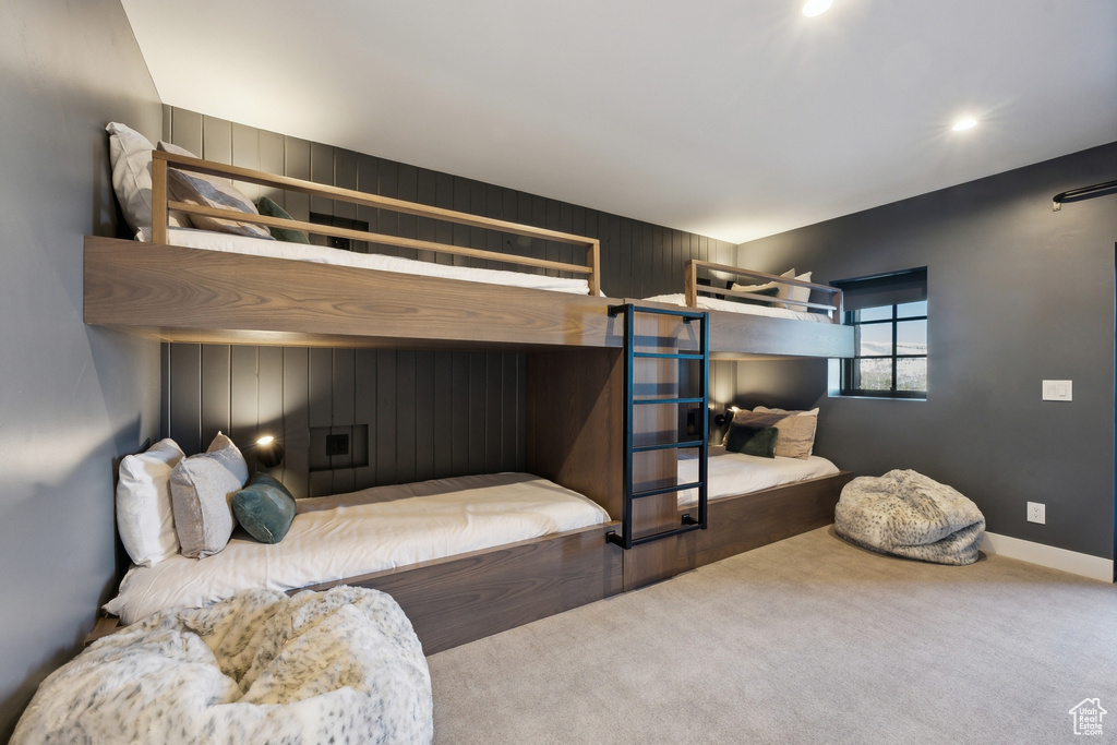 Carpeted bedroom featuring baseboards