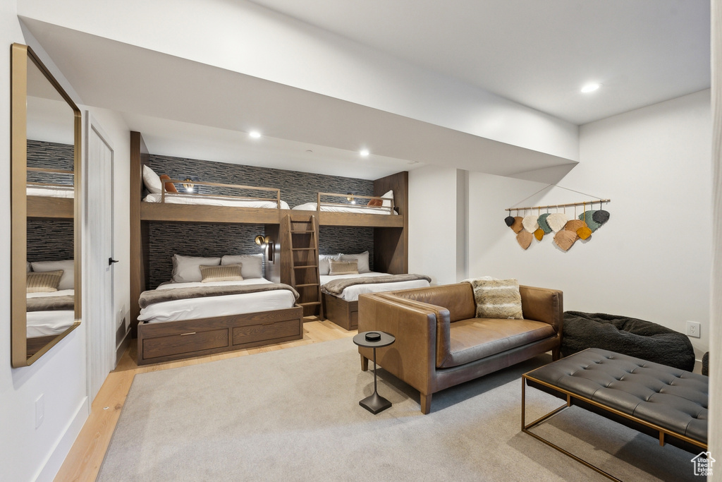 Bedroom with wood finished floors and recessed lighting